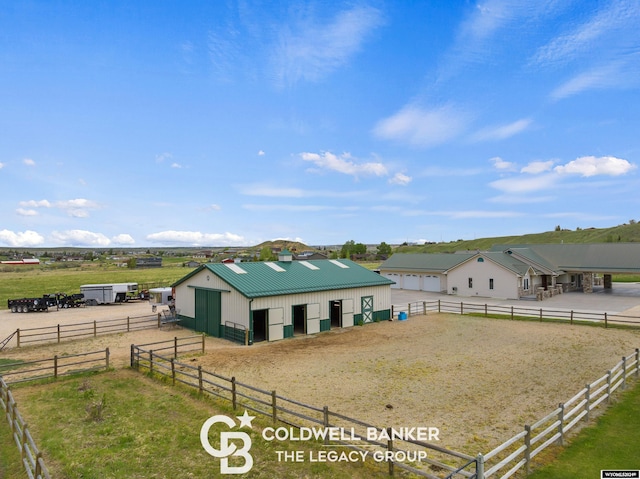 exterior space with an outbuilding and a rural view