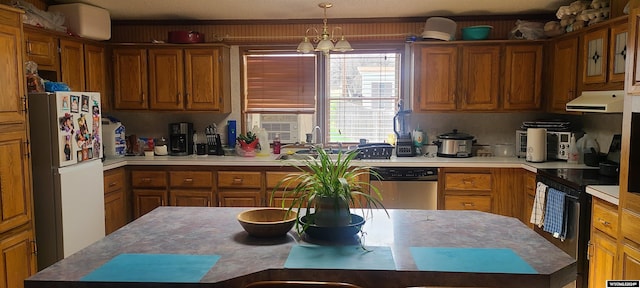 kitchen featuring stainless steel appliances, brown cabinetry, and range hood