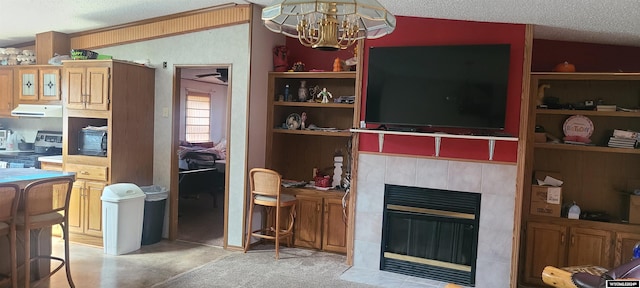 living area featuring a textured ceiling, a chandelier, light carpet, a fireplace, and vaulted ceiling