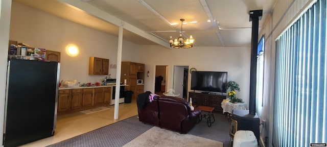 living room featuring light colored carpet and a notable chandelier