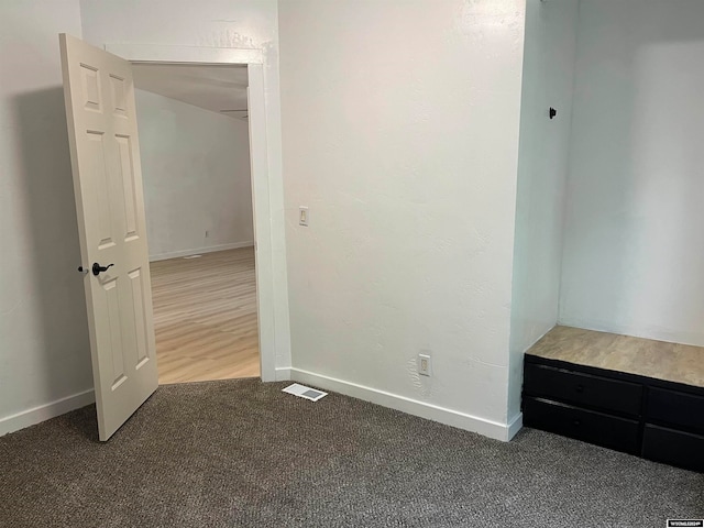 unfurnished bedroom with hardwood / wood-style floors