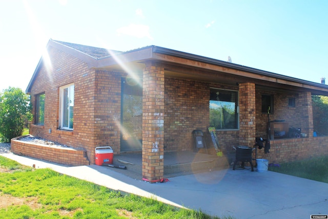 view of property exterior featuring a patio area