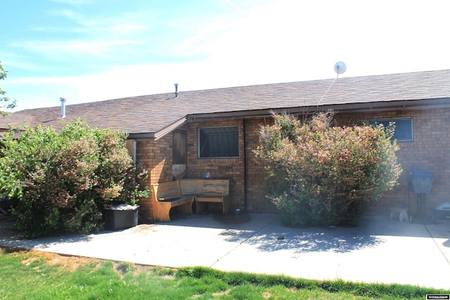 entrance to property featuring a patio area