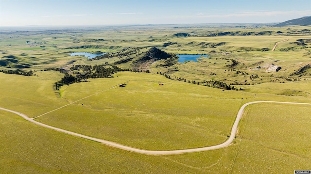 birds eye view of property with a water view and a rural view