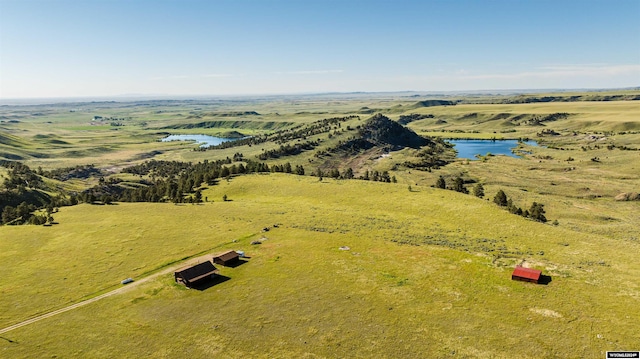 aerial view with a rural view and a water view