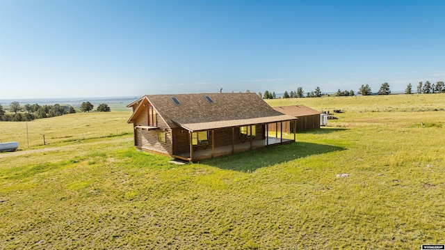 exterior space featuring a yard and a rural view