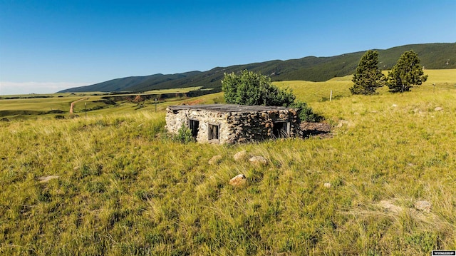 view of mountain feature with a rural view