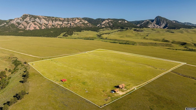 birds eye view of property featuring a mountain view and a rural view