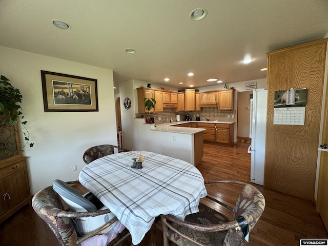 dining area featuring dark hardwood / wood-style flooring