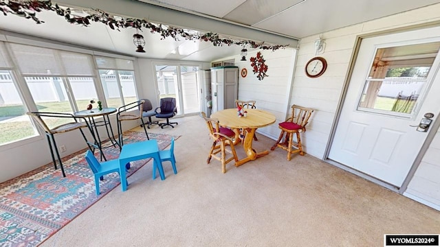 dining area with light colored carpet