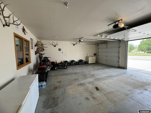 garage featuring a garage door opener