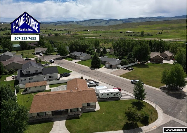 birds eye view of property featuring a mountain view