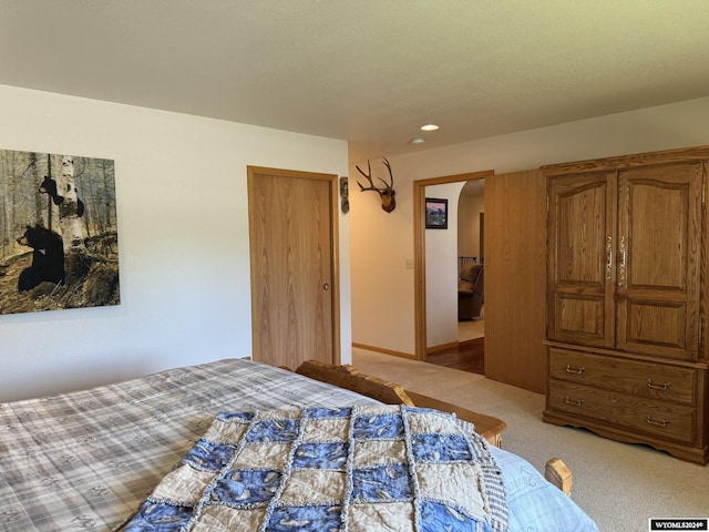 bedroom with light colored carpet