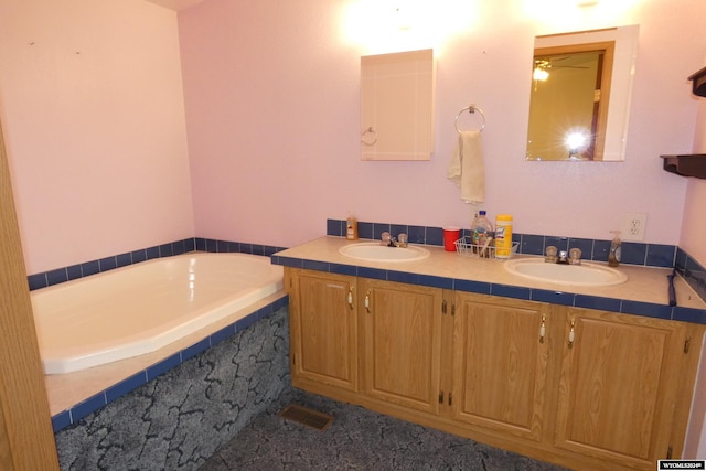 160 Pleasant Valley Rd, Hartville, WY 82215 - bathroom with vanity and a relaxing tiled tub