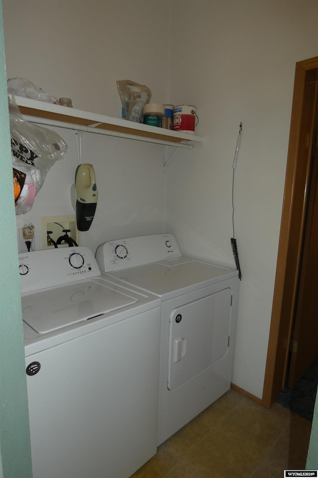 160 Pleasant Valley Rd, Hartville, WY 82215 - clothes washing area featuring separate washer and dryer and light tile patterned floors