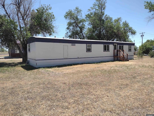 back of house with a yard