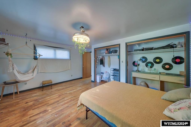 bedroom with hardwood / wood-style flooring