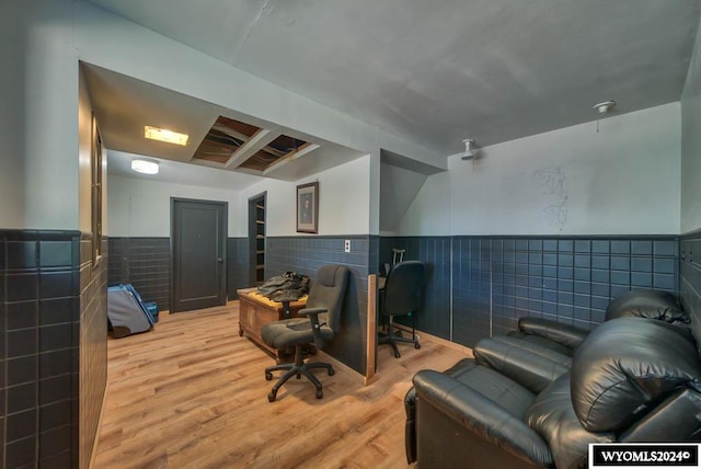 office featuring tile walls and hardwood / wood-style flooring