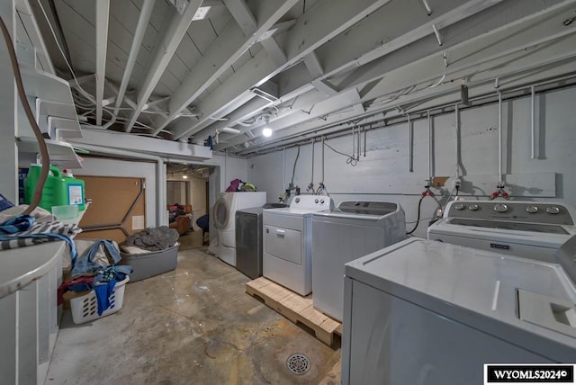 clothes washing area featuring washing machine and clothes dryer