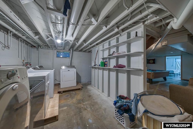 laundry area featuring washing machine and dryer and billiards