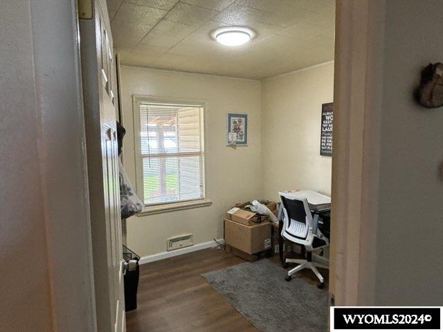 office area featuring dark wood-type flooring