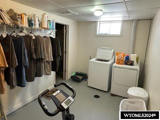 laundry area with washing machine and clothes dryer