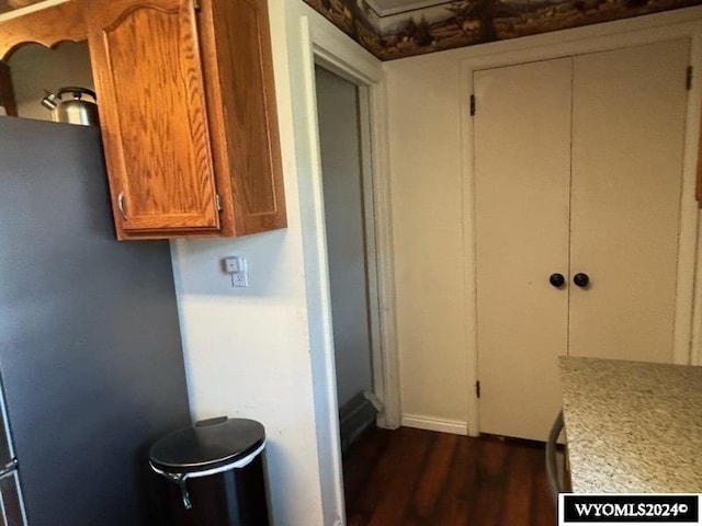 kitchen with dark hardwood / wood-style flooring