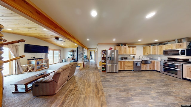 kitchen featuring dark hardwood / wood-style floors, stainless steel appliances, light brown cabinets, and ceiling fan