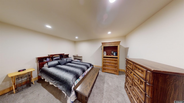 bedroom featuring light carpet