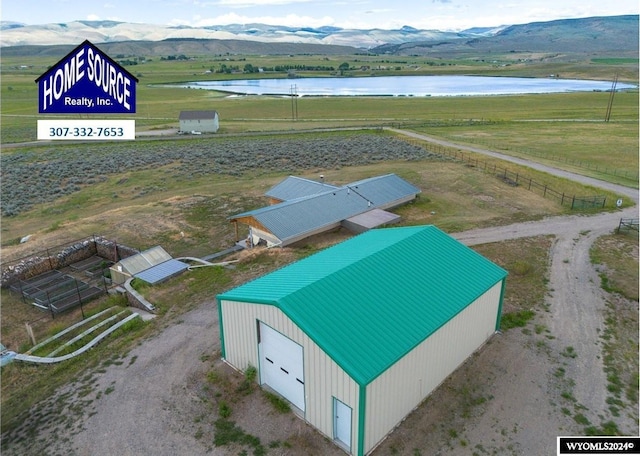 bird's eye view with a water and mountain view and a rural view