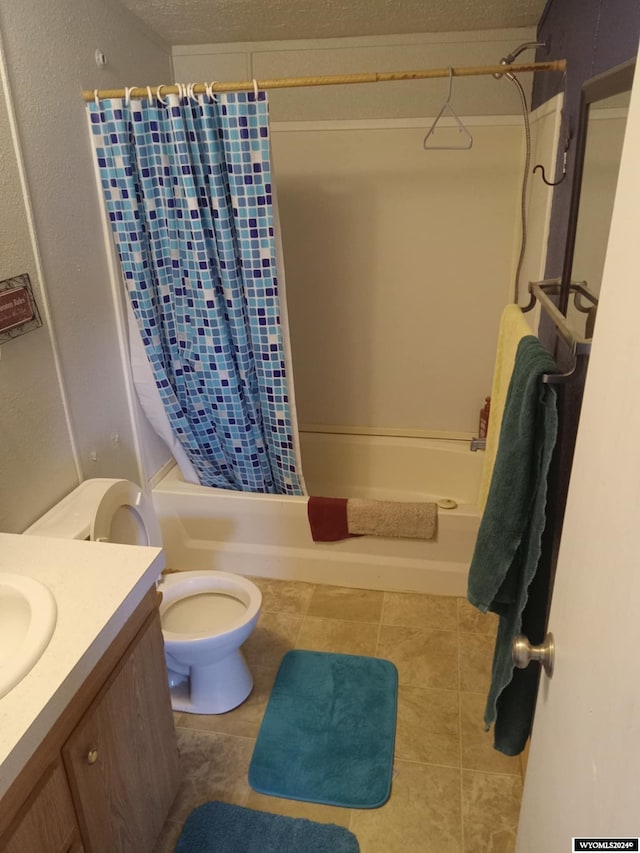 full bath with toilet, tile patterned flooring, shower / bath combo with shower curtain, and vanity