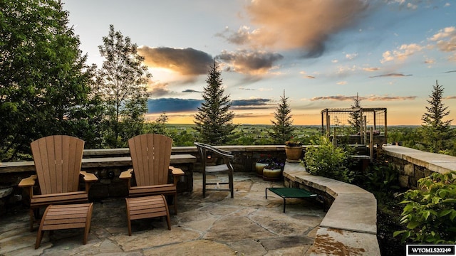 view of patio terrace at dusk