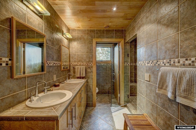 bathroom with vanity, tile walls, wooden ceiling, and toilet