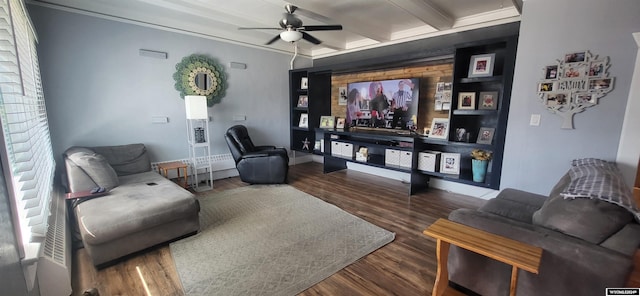 living room with ceiling fan, crown molding, beamed ceiling, and dark wood-type flooring