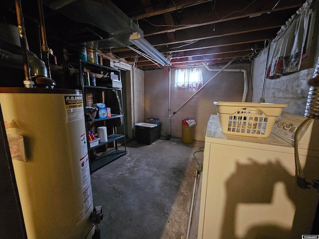 basement with washing machine and dryer and water heater