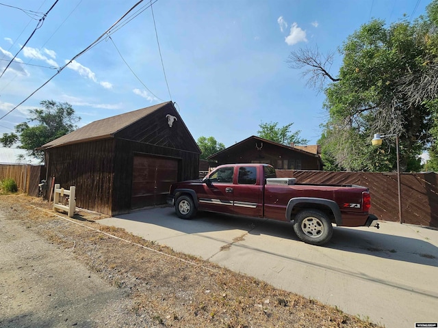 exterior space with an outdoor structure and a garage