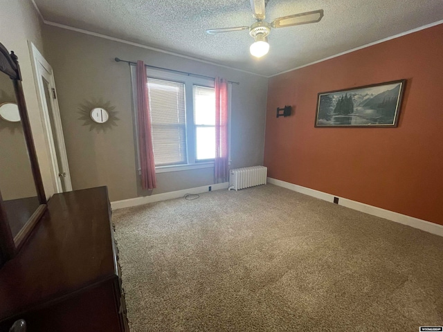 interior space featuring a textured ceiling, radiator, carpet, and ceiling fan