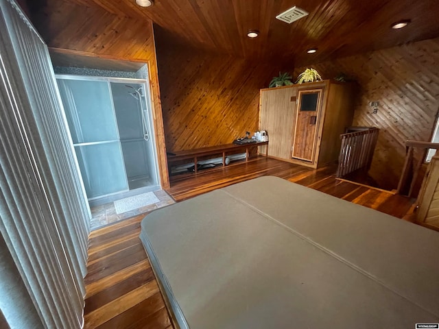 interior space featuring wooden walls, dark hardwood / wood-style flooring, and wood ceiling