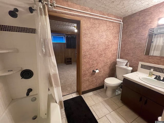 full bathroom with tile patterned flooring, shower / bathtub combination with curtain, toilet, and vanity