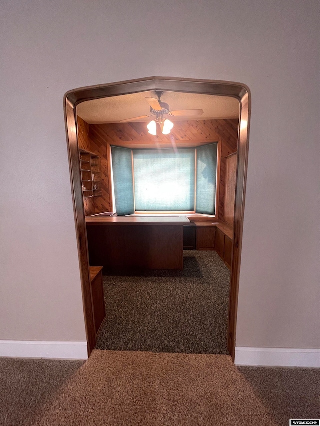 hallway with carpet floors