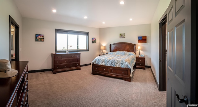 carpeted bedroom featuring recessed lighting and baseboards