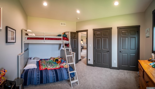 carpeted bedroom featuring recessed lighting and visible vents