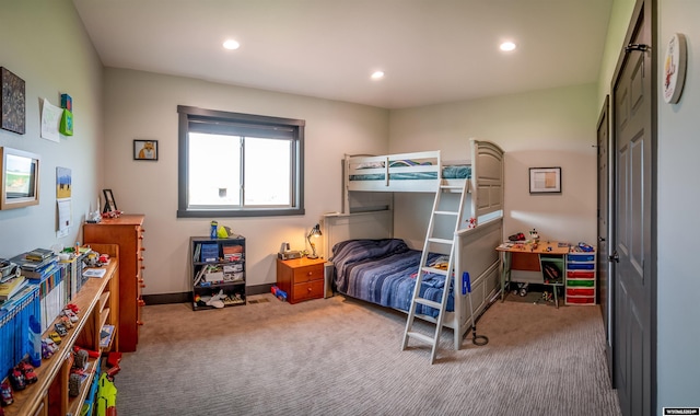 carpeted bedroom featuring recessed lighting and baseboards