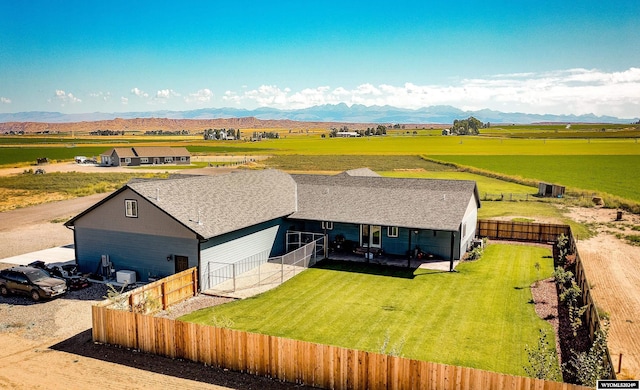 birds eye view of property with a mountain view and a rural view