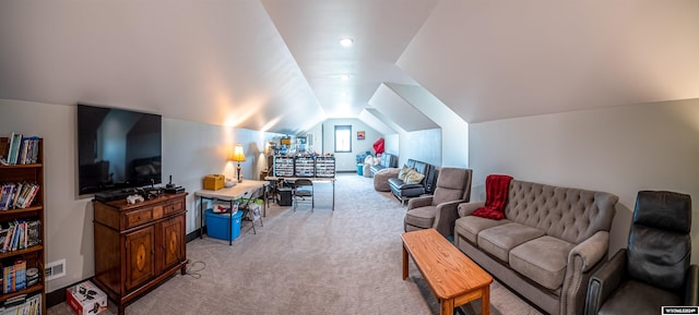 living area featuring light carpet, visible vents, and vaulted ceiling