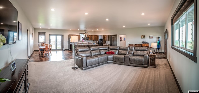 living room with recessed lighting and baseboards