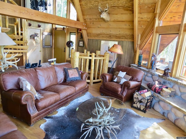 living room featuring vaulted ceiling, hardwood / wood-style floors, and wooden walls