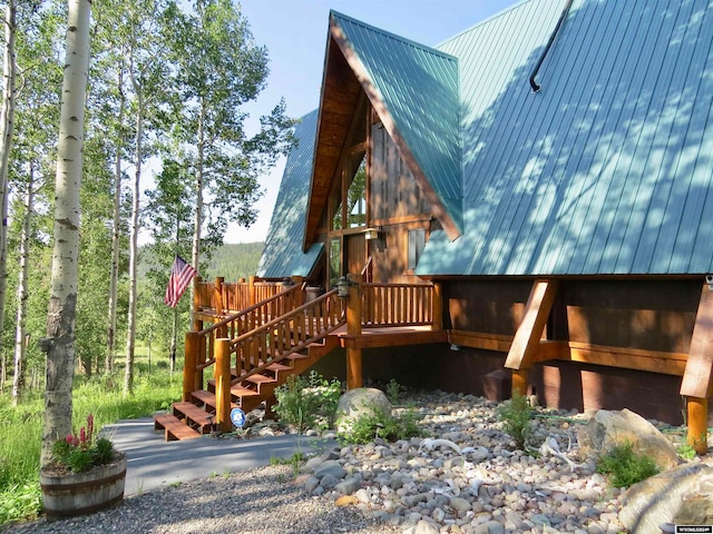 view of side of home featuring a wooden deck