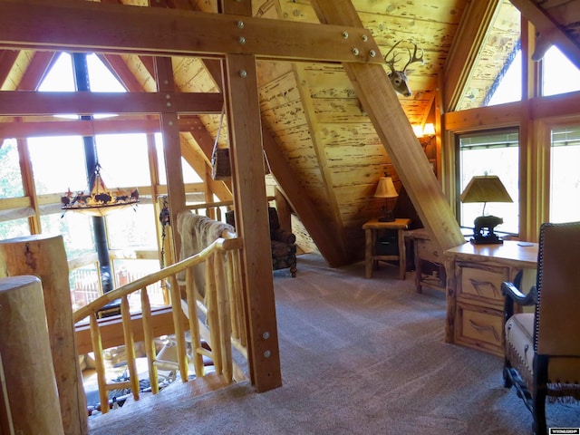 office space featuring lofted ceiling with beams, wood ceiling, and carpet