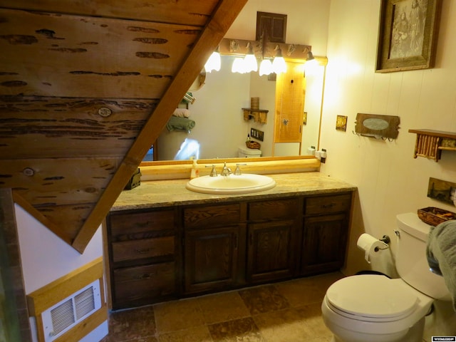 bathroom with tile patterned floors, toilet, and vanity